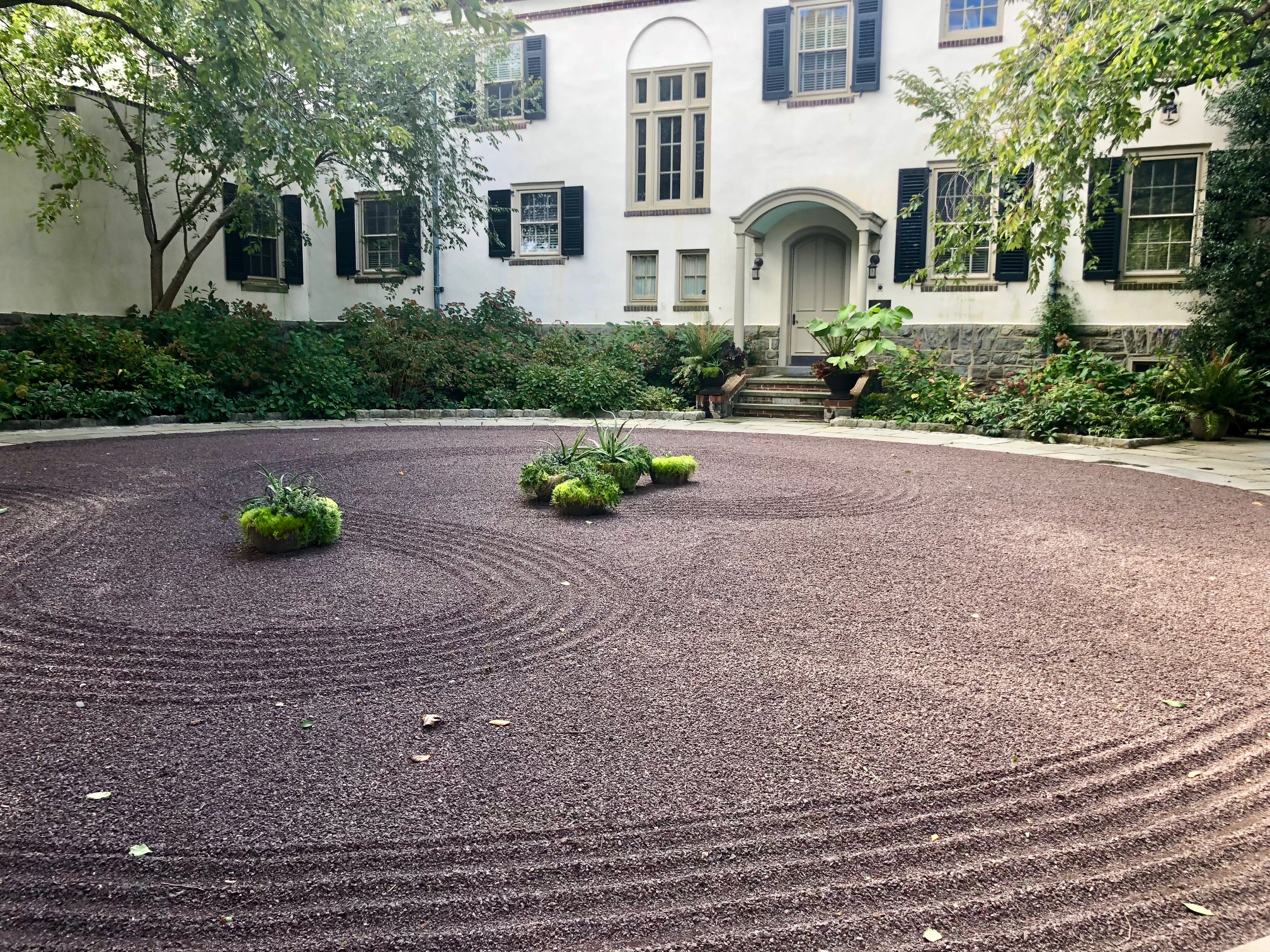 Decorative racked gravel courtyard garden at Chanticleer. More at Thinking Outside the Boxwood